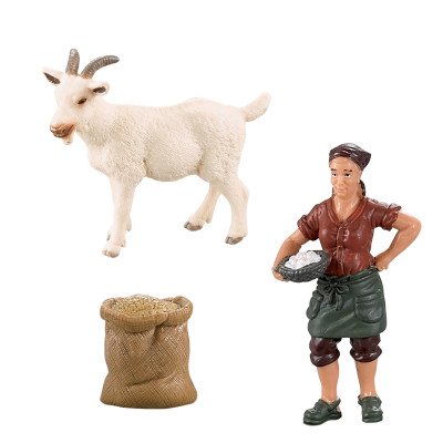 Sada koza s kozľatom a farmárkou